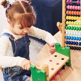 cheerful-little-girl-in-casual-clothes-playing-in-2CHG2VH.jpg